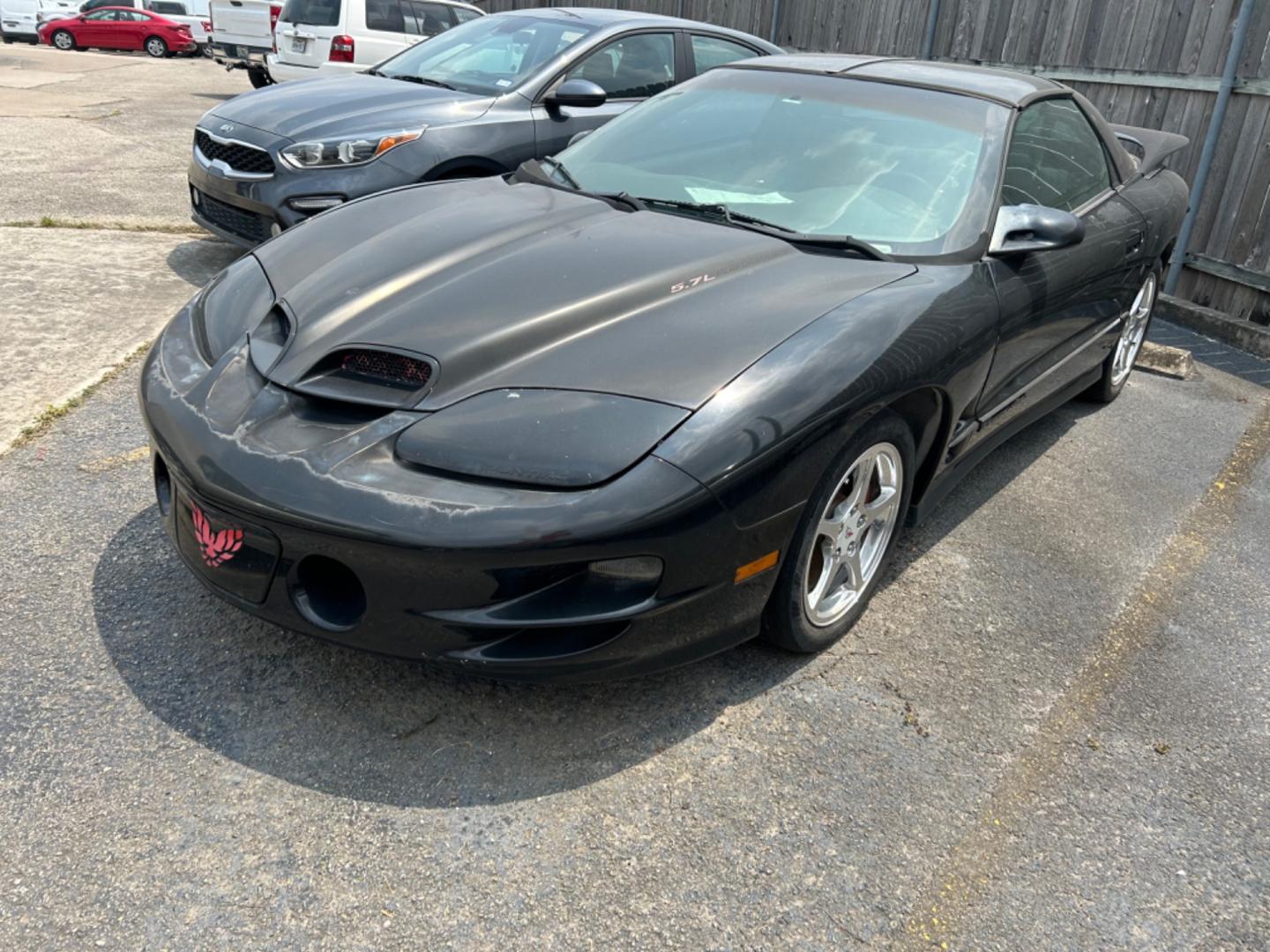 2002 Black Pontiac Firebird Formula Coupe (2G2FV22G522) with an 5.7L V8 OHV 16V engine, located at 1687 Business 35 S, New Braunfels, TX, 78130, (830) 625-7159, 29.655487, -98.051491 - Photo#0